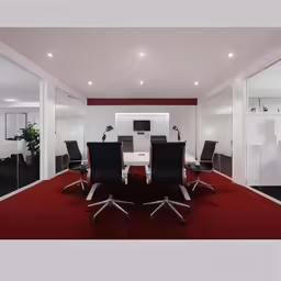 a room that has a table and chairs on it