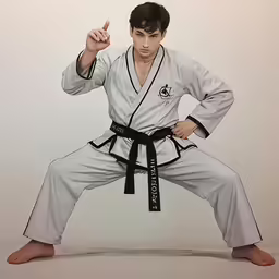 man wearing white karate uniform posing for the camera