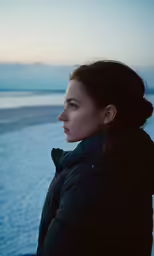 a woman looking out at the water