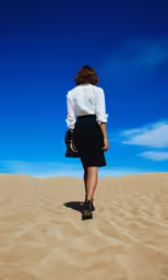 the woman is walking across the sand in high heels