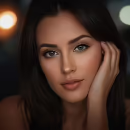a beautiful woman is holding her hand on her head