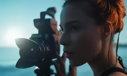 a woman taking photos with a video camera