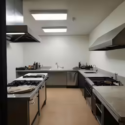 a kitchen with stainless steel appliances and counters
