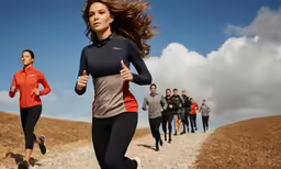 a woman running with people standing in the background