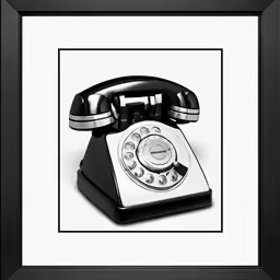 an old style telephone with a black frame