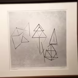 a large framed drawing on paper with abstract lines