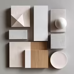 some white plates and small shapes on a table