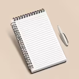 a notepad and pen sitting next to an empty notebook