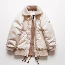 a white jacket with a tan hood