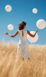 a woman is running through some wheat field with bubbles