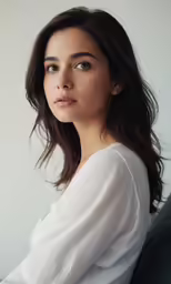 a beautiful young woman posing for a picture