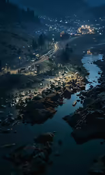 night time picture of a river flowing through a valley