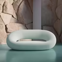 there is a modern sofa next to a wall