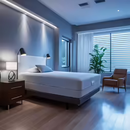 a bedroom with an overhead light and hardwood flooring
