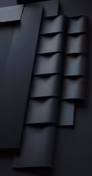 a black wall with many folds and layers of material