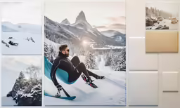 a man is sitting in snow gear and wearing skis