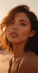 a woman posing on the beach for a portrait session