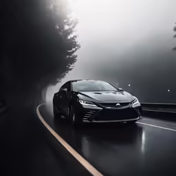 the black sport car driving on the road