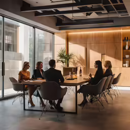 people are having conversation at an office meeting