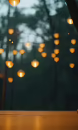 an outdoor table with some lights shining on it