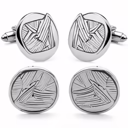a pair of cufflinkes in the shape of a football field
