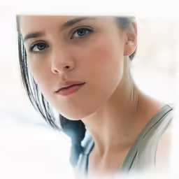 woman with braided hair looking away, slightly to the side