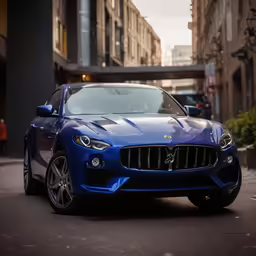 a blue masera sedan parked on a street