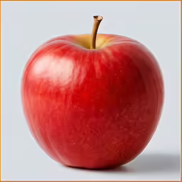 an image of an apple with something in the background