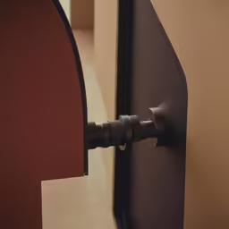 an open door with a large black handle