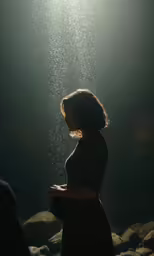 an artistic photograph of a woman under water