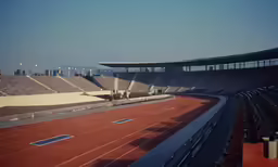 a view of an empty stadium from across the track