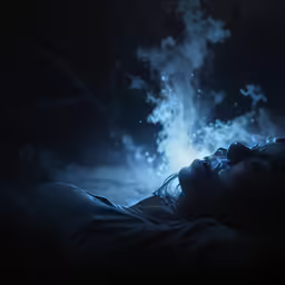 a man and woman face to face in darkness