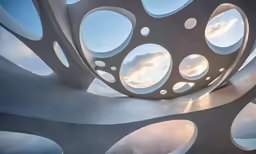 a sculpture that is made with circles in the middle of the building