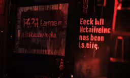 signs advertise social events in a bar
