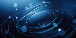 circles made of black, blue and white lights with dark background