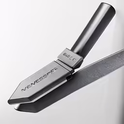 a black knife sitting next to another knife