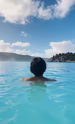 a man who is swimming in the water