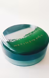 a blue and green box with a tooth brush in it