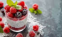 a glass of raspberry chimex topped with mint