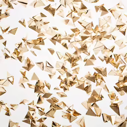 a group of origami is flying across the air