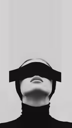 a man with a blindfold over his face,a mannequin wearing a black scarf and blindfold