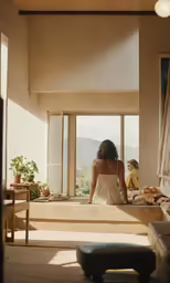 a woman in a dress is standing on the couch
