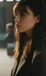 a woman is looking off into the distance