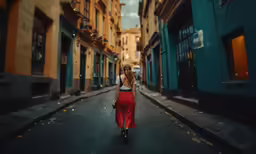 woman wearing a red long skirt walking down the street