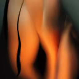 there is a beautiful naked woman in orange light
