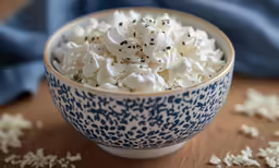 a bowl filled with white and black sprinkles