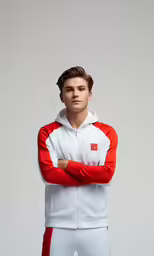 a man posing for the camera with his arms crossed