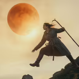 a woman in armor holding a sword as the sun rises