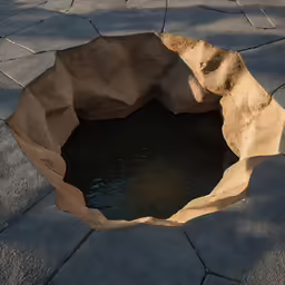 a hole in the ground that appears to have water inside