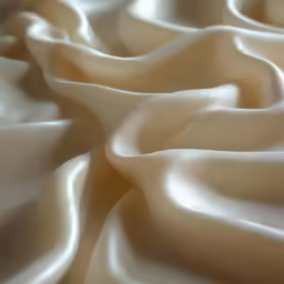 a close - up view of white fabric that is soft